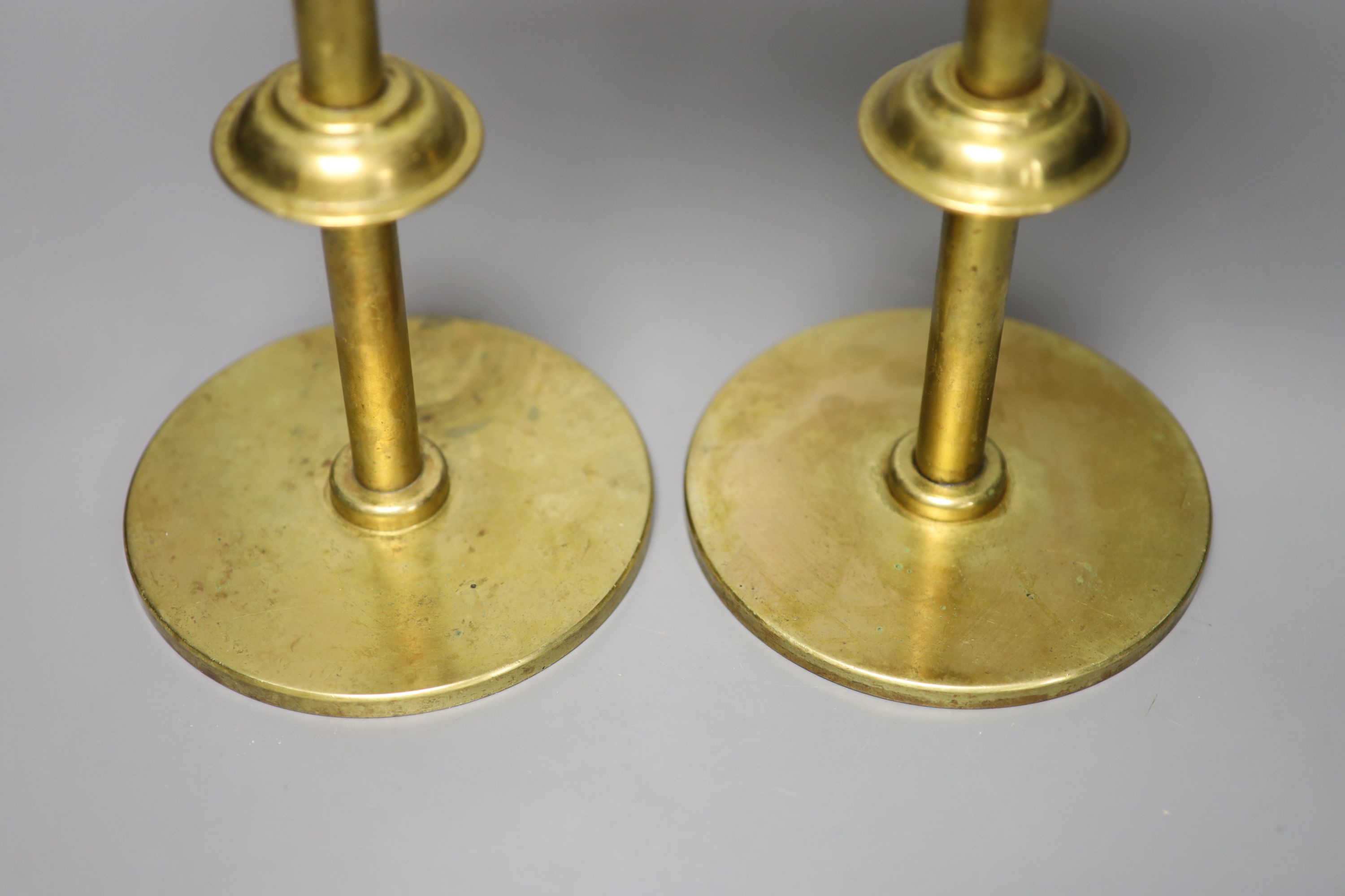 A pair of brass telescopic display stands